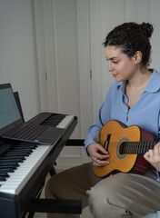 Woman plays guitar