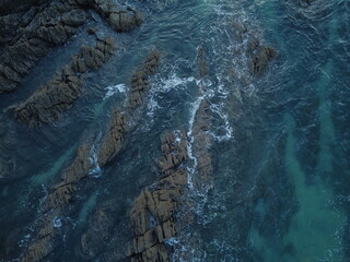 down facing shot of blue ocean with rocky landscape  © samuel
