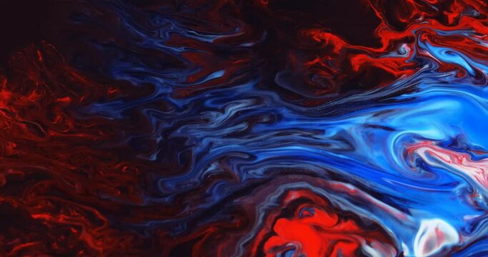 Abstract unique moving background with blue, red paint on a black substrate. Liquid art, fluid paints, macro-image. Abstract red particles, wave, shiny stripes, moving background