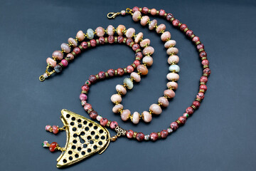 Unique colorful gemstone necklace, handmade jewelry concept, promotional photo for an online...