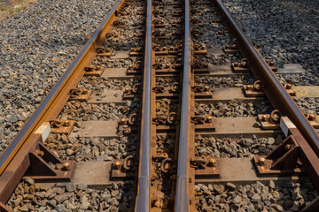 Railroads track on the industrial area with blue sky and lake. The photo is suitable to use for...