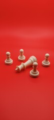 White chess pieces on a red background