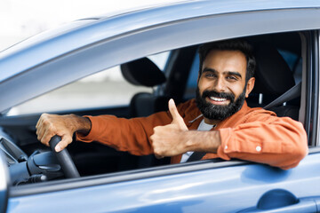 Middle Eastern Man Approving Car Gesturing Thumbs Up In Automobile