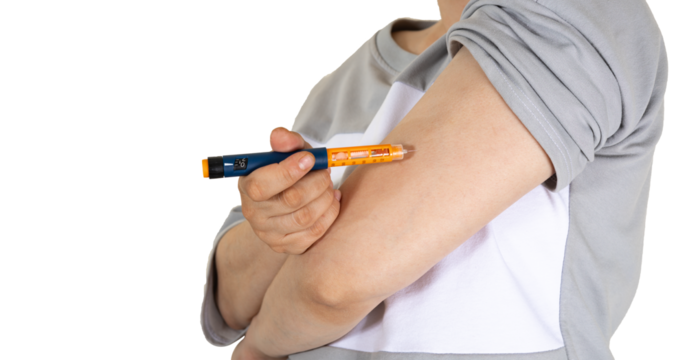 Woman doing insulin injection pen, close-up. Diabetic patient with insulin pen for control diabetes hormone therapy. Selective focus. isolated on white. - Powered by Adobe
