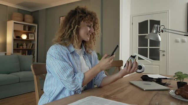 One woman adjust home surveillance security camera scan code