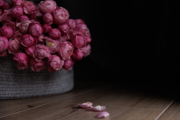 bouquet of pink roses on wooden background