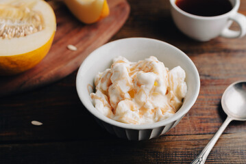 Melon Ice Cream with Fruit Syrup in Bowl