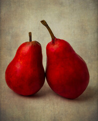 Two red Pears Leaning On Each Other