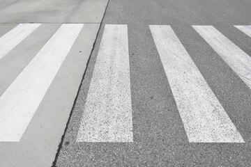 Pedestrian crossing on a repaired asphalt road