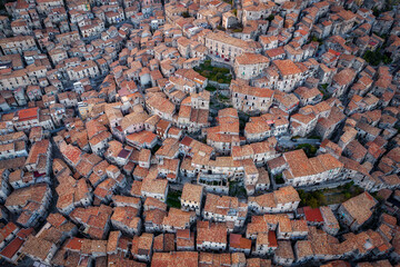 Aerial view of crowded residential houses on the hill in an Italian traditional village, Morano Calabro