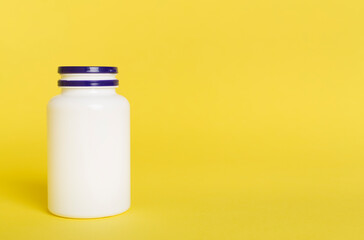 Plastic bottle for vitamins on color background