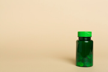 Plastic bottle for vitamins on color background