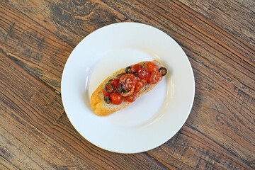Bruschetta. Cherry tomatoes and olives Bruschetta, vegetarian food. Selective focus