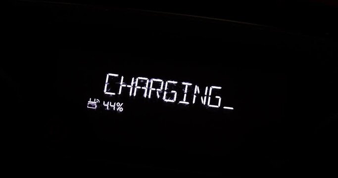 Battery charging symbol glowing close up