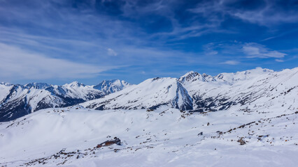 A beautiful winter day in the high mountains - generative ai