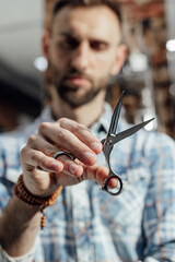 Close up photo scissors for haircut in barbershop