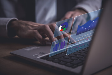 Analyst working with computer in Business Analytics and Data Management System to make report with KPI and metrics connected to database. Corporate strategy for finance, operations, sales, marketing.