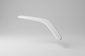 White boomerang flying in mid-air on white background creating monochrome style. Illustration of the concept of returning