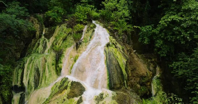 View from above of unique steaming Bilawa Hot Waterfall. Davao de Oro, Philippines.
