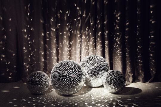Many shiny disco balls in dark room - Powered by Adobe