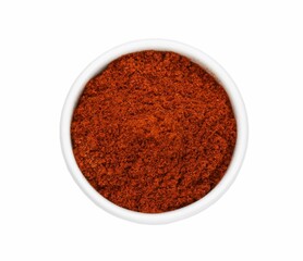 Bowl with aromatic paprika powder isolated on white, top view