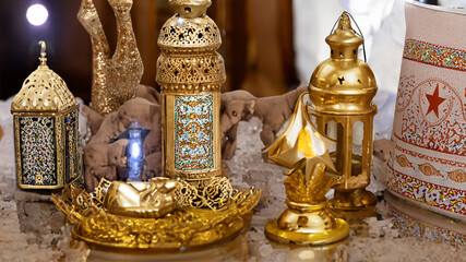 Fototapeta na wymiar golden islamic symbol candles on the table