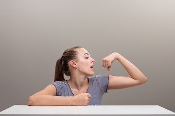 Polishes ring, flexes muscle, shows power