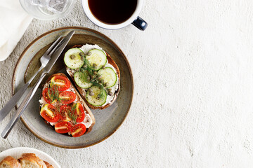 Healthy cucumber and tomato toast.