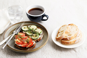 Healthy cucumber and tomato toast.