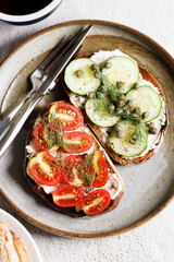 Healthy cucumber and tomato toast.
