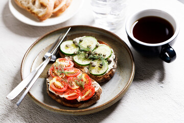 Healthy cucumber and tomato toast.