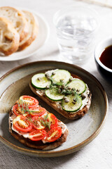 Healthy cucumber and tomato toast.