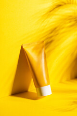 Sunscreen cream in the yellow plastic tube