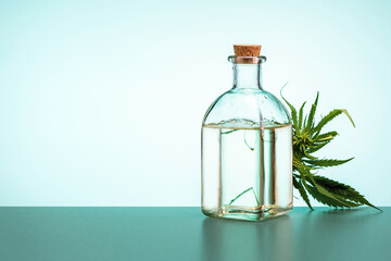 Medical marijuana plant. cannabis with extract oil in a bottle on light background with copy space.