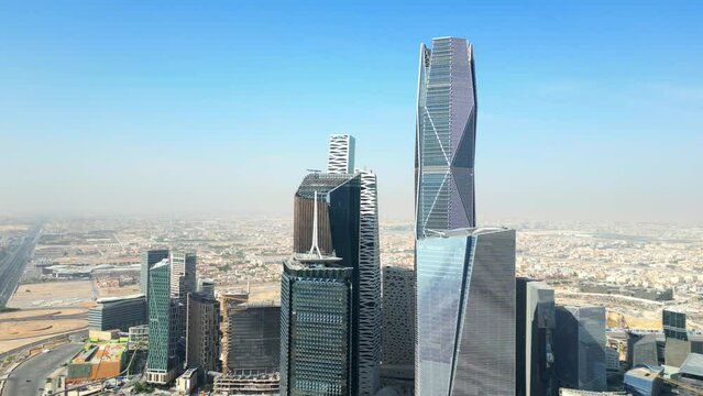 Drone shot beautiful tall glass skyscrapers in city in Middle East