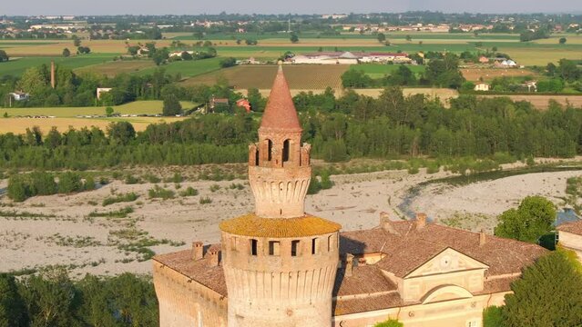 Rivalta Castle in Italy and dry waterless Trebbia river. Aerial circling