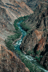 Obraz premium stormy river in the canyon