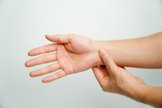 Health Care Concept. Asian Man Holding His Wrist With Office Syndrome, Pain In The Joints Of The Hands. Carpal Tunnel Syndrome.