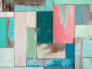 multicolor effective wood texture pattern background consists of several pieces of old wood of various sizes and colors, white, blue, green. Old wooden planks in multi-pastel colours vintage style.