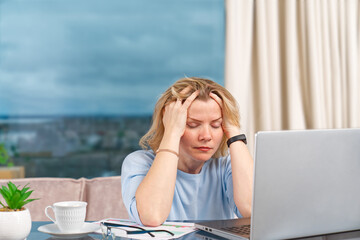 Unhappy tired woman at home office working with laptop. Stress, depression, loneliness, fatigue,...