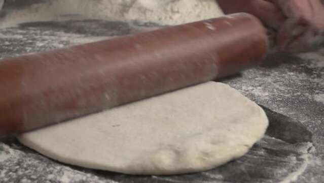 making pizza the traditional way, brazilian pizzeria