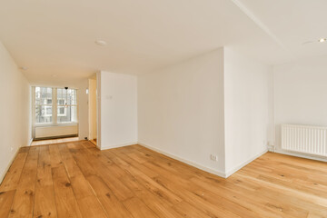 Fototapeta premium an empty living room with wood flooring and white walls in the room is very light, bright and clean