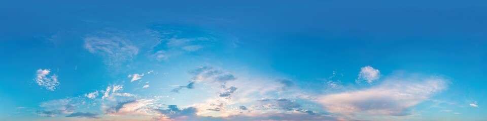 Sunset sky panorama with bright glowing pink Cirrus clouds. Seamless hdr 360 panorama in spherical...