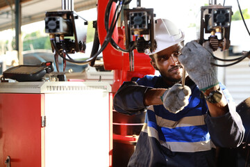 Professional heavy industry technician engineer in safety workwear maintenance and check part of...