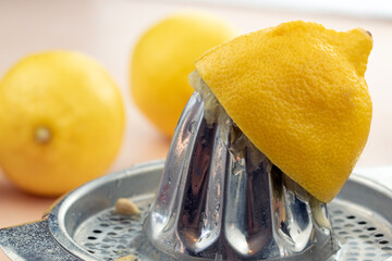 Half lemon on a hand juicer