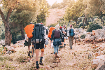 Group of hikers walking by the Lycian Way footpath in turkish countryside