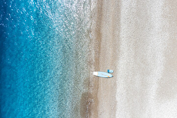 Aerial view of a beach in Turkey with one sup board near the sea. Paradise resort and vacation