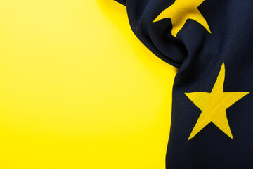 Overhead view of flag of europe over yellow background, copy space