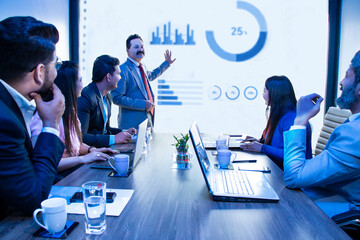 Indian business people meeting presentation in office conference room show company growth sales...