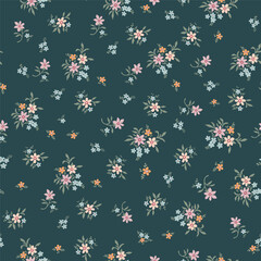 Fashionable pattern with small flowers on a green background. Seamless botanical print with various floral elements. A collection of vintage textiles for fabric and wallpaper.